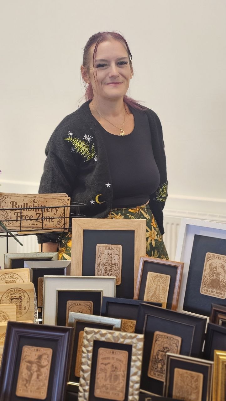 Amiee behind the Bear Phoenix Creations framed card display